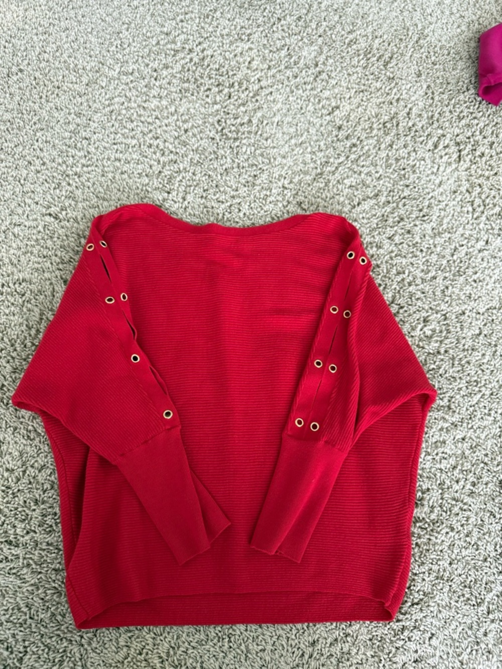 Jennifer Lopez Red Sweater with Grommet Sleeve Detail